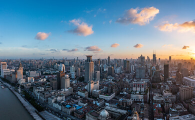 Aerial view of city skyline and modern buildings in Shanghai at sunset, China.