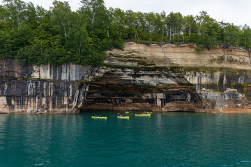 Fototapeta na wymiar Kayakers on Lake Superior at Pictured Rocks National Lakeshore, Upper Peninsula, Michigan, USA 