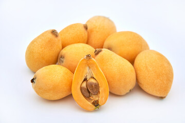 Ripe loquat on a white background