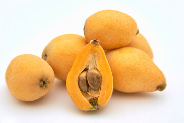 Ripe loquat on a white background