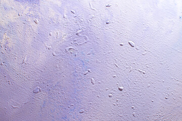 abstract creative background: oil paint frozen in a container after dilution, light color toning, short focus.