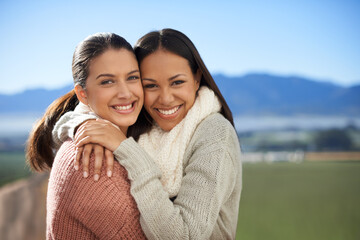 Friedship that will last. Two young female friends standing happily in the outdoors.