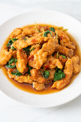 stir-fried fried fish with basil and chili in thai style