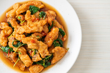 stir-fried fried fish with basil and chili in thai style