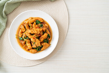 stir-fried fried fish with basil and chili in thai style