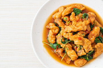 stir-fried fried fish with basil and chili in thai style