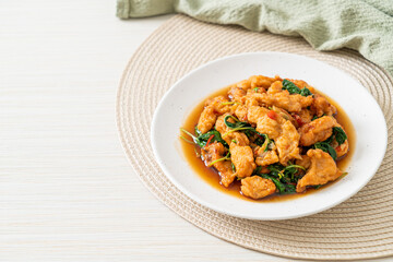 stir-fried fried fish with basil and chili in thai style