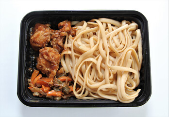 Pork in teriyaki sauce. Lunch in a disposable dish.