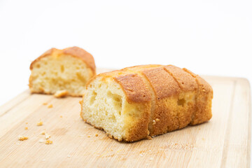 Pound cake on cutting board isolated on white background