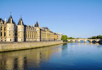 Fototapeta na wymiar Beautiful panoramic view from the Seine River to the bridge and the city landscape on a sunny summer day. Paris, France