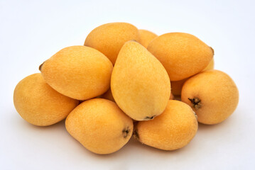 Ripe loquat on a white background