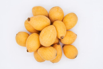 Ripe loquat on a white background