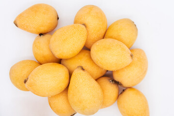Ripe loquat on a white background