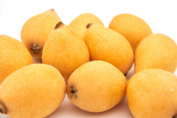 Ripe loquat on a white background