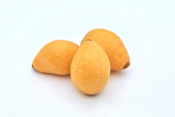 Ripe loquat on a white background