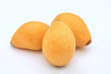 Ripe loquat on a white background