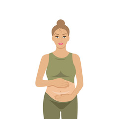 a pregnant girl in a green suit hugs her belly and gently strokes her unborn child