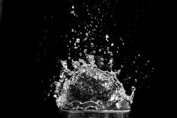 Water scattered on a black background. Water splashing on a black background. isolated splash on black background