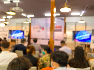 Royalty high quality free stock photo Unidentified peoples are taking a photo in an exhibition event with blurred bokeh background. Copy space for text or advertising or background.