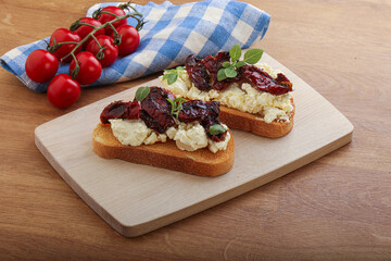 Bruschetta with soft cheese and tomato