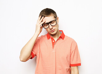 Young handsome man with hand on head for pain in head because stress.