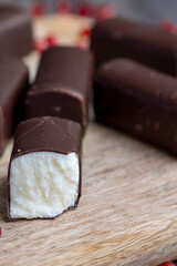 dessert of creamy filling and chocolate on a board
