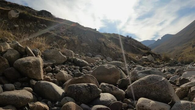 mountainous terrain, nature of the Caucasus, large stones near a mountain river