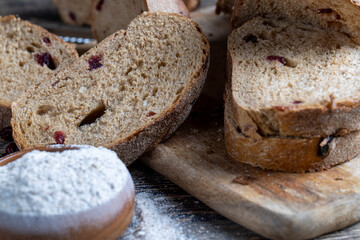 fresh cut bread made of flour and dried cranberries