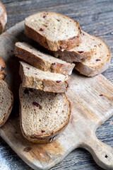 fresh cut bread made of flour and dried cranberries