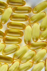 Flat lay fish oil capsules Omega 3 isolated on white background