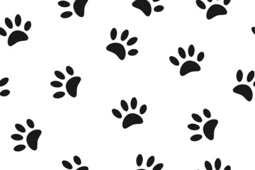 Fototapeta na wymiar Rabbit paws. Seamless pattern with small black footprints of a hare on a white background.