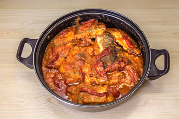fish casserole with tomato sauce and peppers