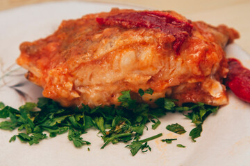 cod slice in tomato and parsley sauce