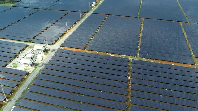Aerial view of solar panels stand in a row in the fields power ecology innovation nature environment green energy landscape electrical power ecology nature environment , invest, economic,solar city