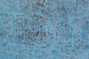 Metal texture everywhere covered with corrosion spots. Old and rusty surface structure of the metal painted with blue paint, high resolution.