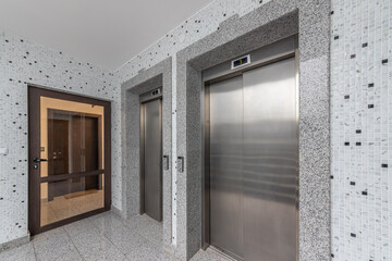 Modern elevators in a business lobby, hotel or store. Interior of modern building.