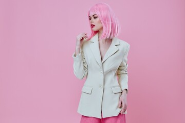 Portrait of a charming lady in a suit makeup pink hair posing color background unaltered