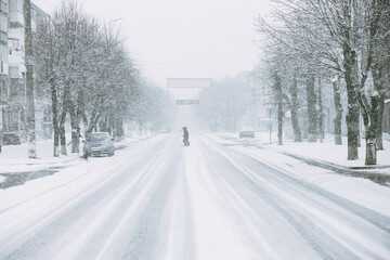 in the city the road is covered with snow