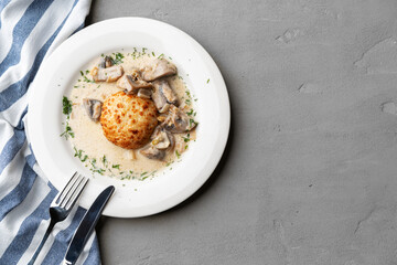 Delicious veal cutlet with melted mozzarella cheese on white plate