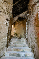 A narrow street among the old stone houses of Castellabate, town in Salerno province, Italy.	
