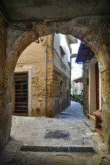 A narrow street among the old stone houses of Castellabate, town in Salerno province, Italy.