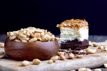 creamy chocolate cake with caramel and roasted peanuts