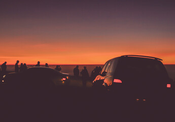Car road trip on The Mountain Silhouette shot. Road trip travel with sunset view. 