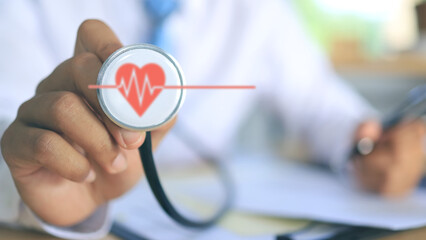 A male doctor using a stethoscope and a red heart icon beating ECG signifies hospital heart disease...