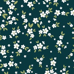 Seamless vintage pattern. Small white flowers, green leaves. Dark background. vector texture. fashionable print for textiles, wallpaper and packaging.