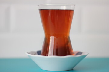 traditional Turkish tea cup filled with hot drink.