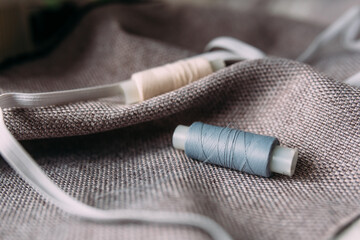  Fabric and thread. The concept of sewing and fashion design
