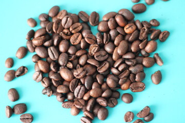 heart shaped coffee beans with blue background