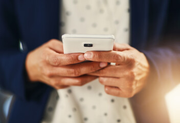 Building close connections towards success. Closeup shot of an unrecognizable businesswoman using a cellphone in an office.