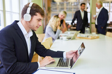 Business start-up man at video conference on laptop